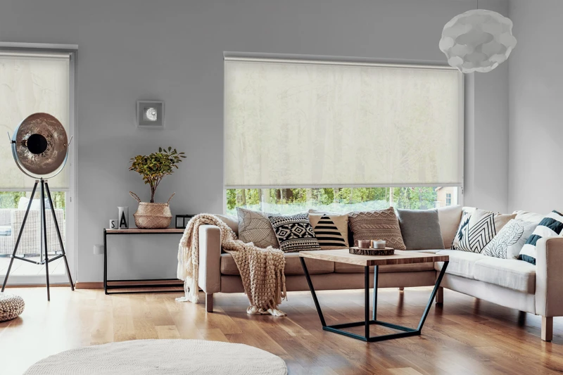 View outside to the green woods through large glass windows in a