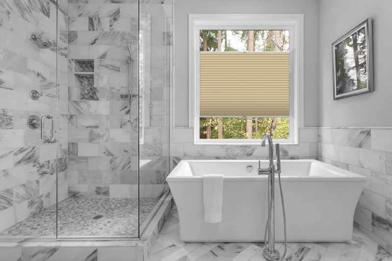 Bathroom with bathtub and shower in new luxury home with all gla